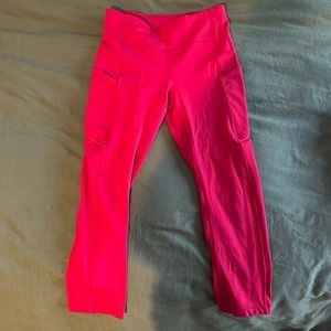 Red Lululemon leggings with 22” length